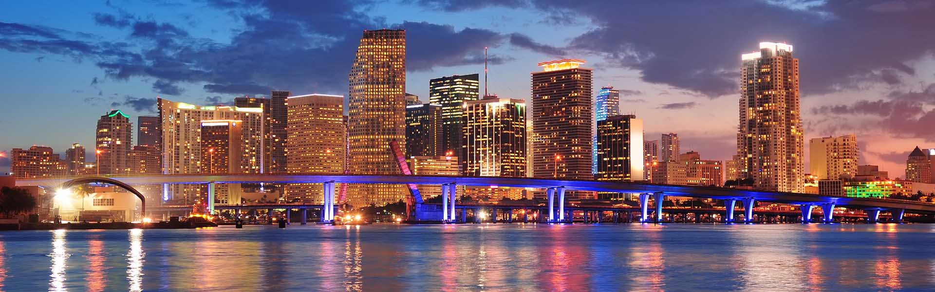 Neon color image of a band playing and people singing along