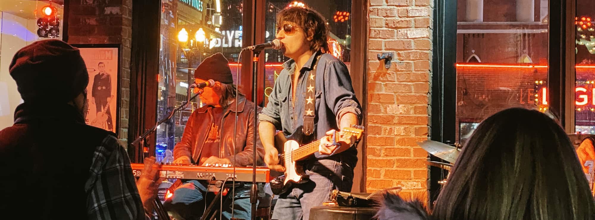bar singer on guitar in Miami